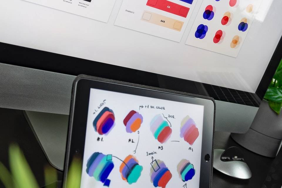 black iPad displaying color gradient