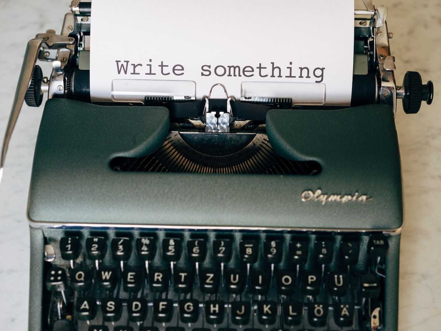 black and white typewriter on green table